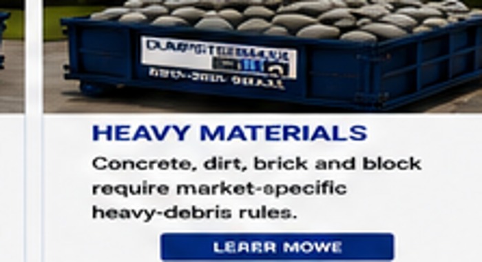 DumpsterMaxx dumpster with heavy materials loaded safely at or below the rim
